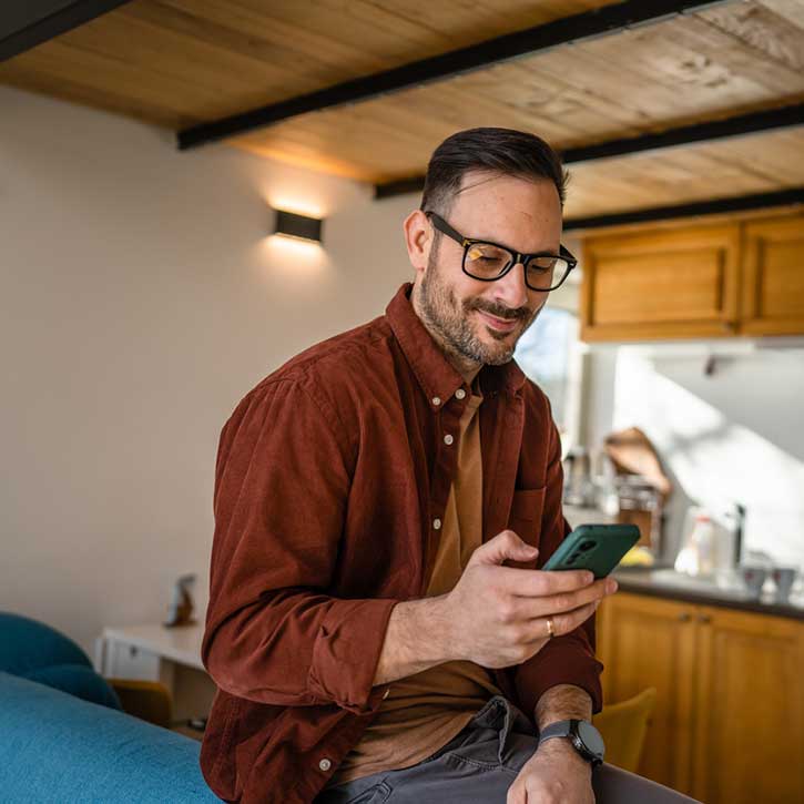 Man applying for auto loan preapproval on phone