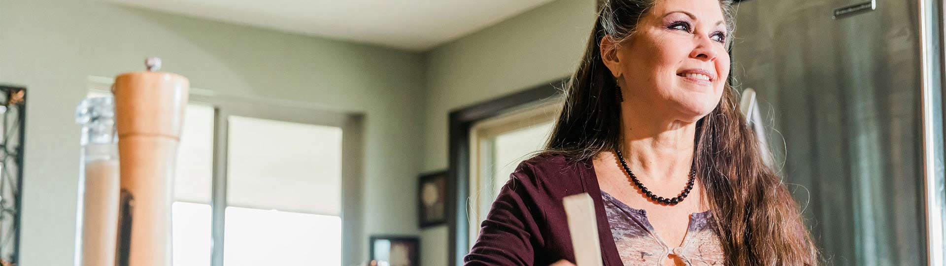 Mature woman smiling in her home